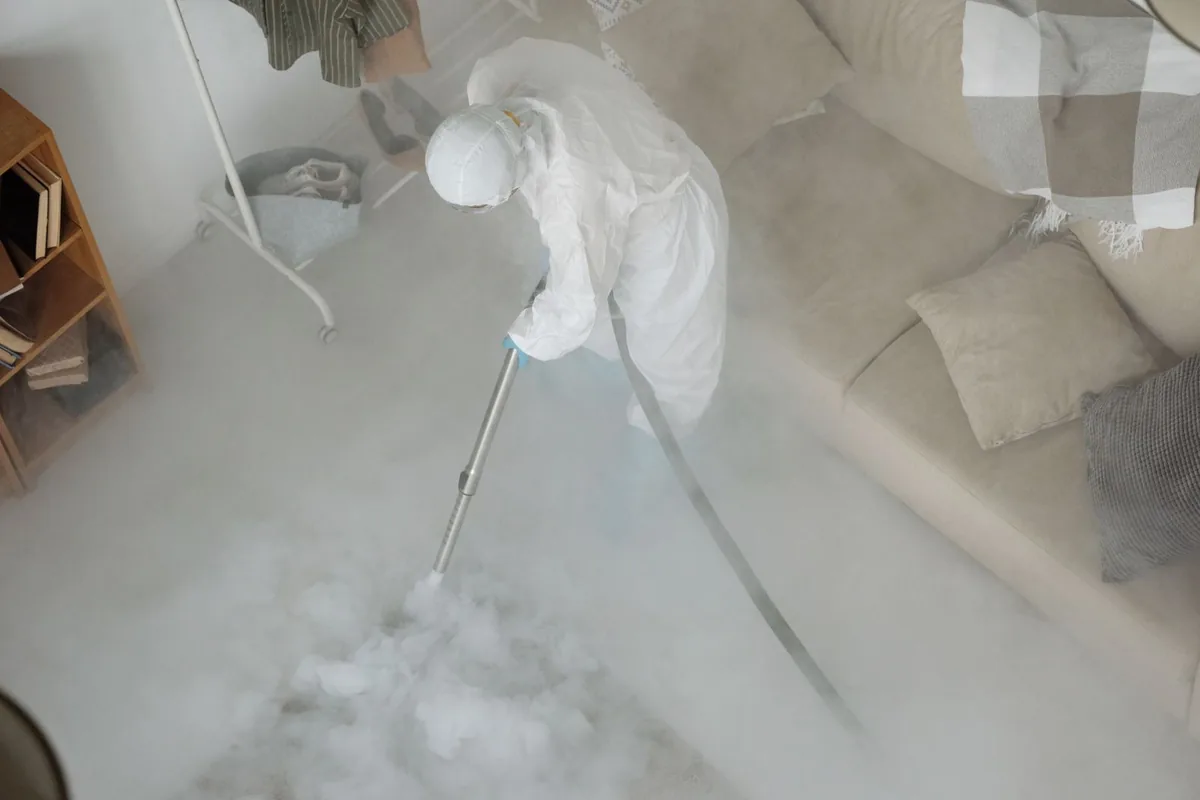 Biohazard cleanup technician in protective equipment, Ridgecrest, LA